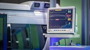 ECG machine monitoring patient vitals in a hospital setting